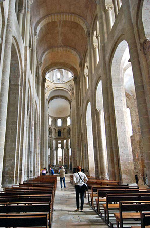 The Cathedral of St Foy, Conques, 1087-1107 France, demonstrates the limitations of the groin vaults used to roof the nave. The nave is extremely narrow, almost like a tunnel -- it was the pointed arches and rib vaults used at Durham that were to enable later buildings to solve this problem - allowing for vaults that spanned much greater widths and soared much higher. 